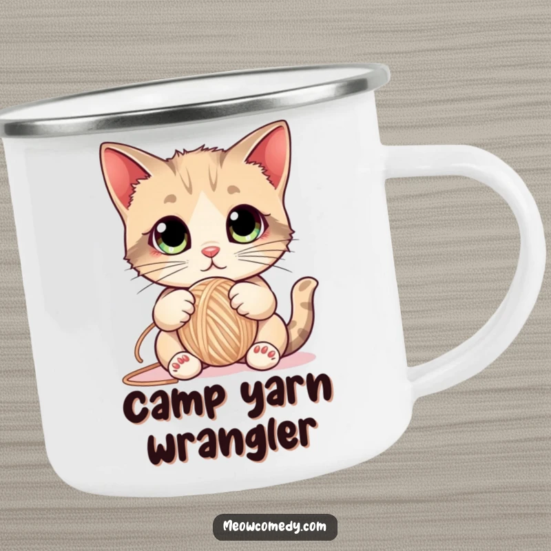Funny Cat Camping Mug showing a cute kitten with large eyes playfully batting a ball of yarn, designed for durability and feline fun.