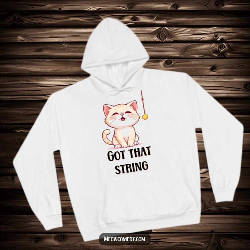 Funny cat hoodie showing a cute cat batting energetically at a dangling string toy with its paws outstretched.