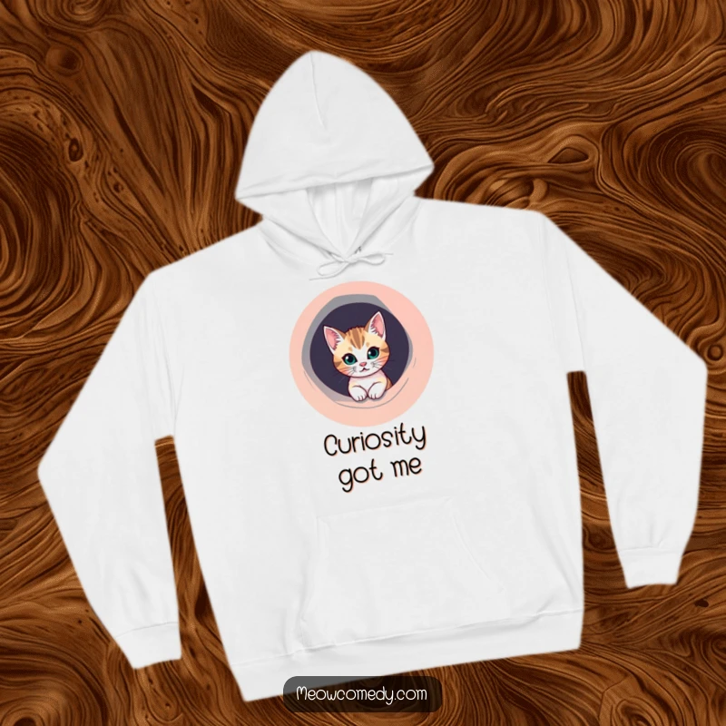 Funny Cat Hoodie: A mischievous cat peeks out from a perfectly round, colorful hole, embodying playful curiosity.