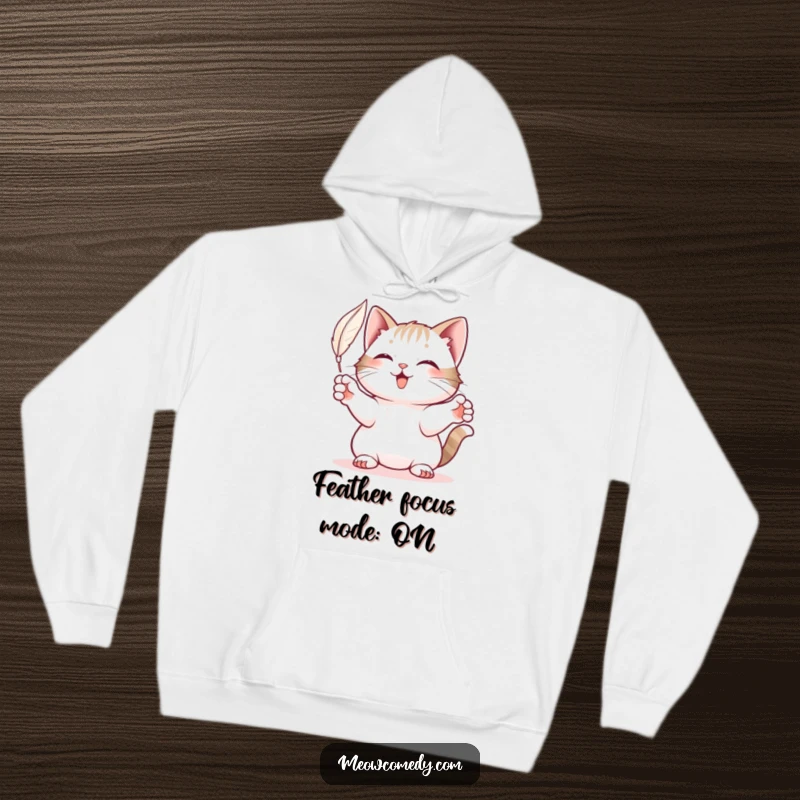 Funny Cat Hoodie: A cute cat, paws extended, in mid-pounce, playfully batting at a floating feather.