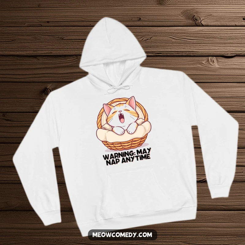 Funny hoodie featuring a cat in a basket, caught in a massive, hilarious yawn, radiating ultimate comfort and sleepiness.