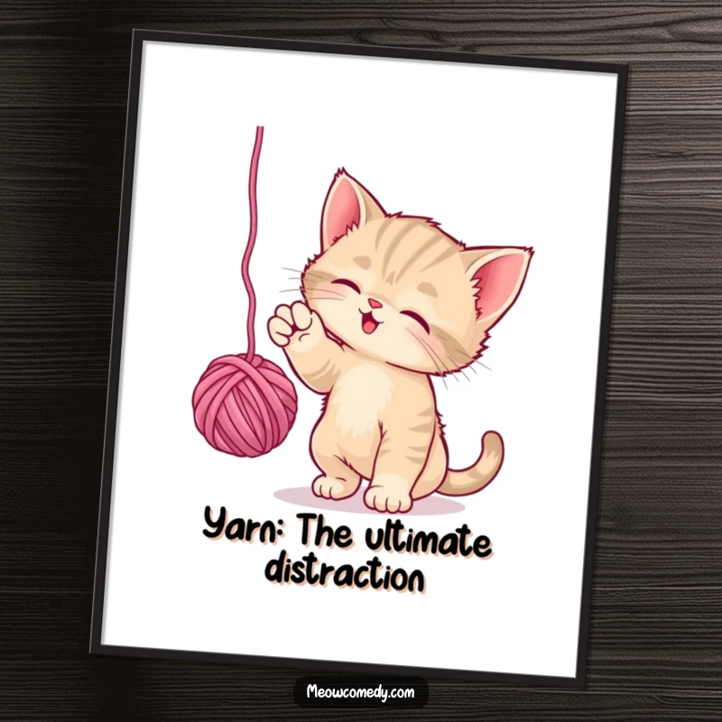 Funny free printable wall art of a playful kitten batting with its paws at a dangling ball of bright yarn.