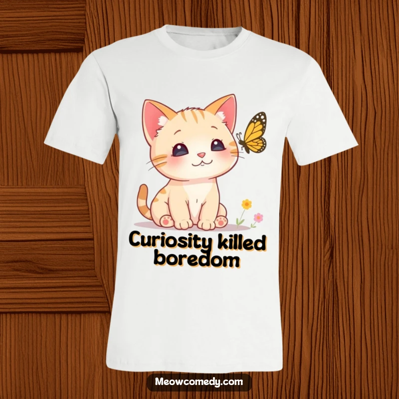 Funny Curious Cat T-Shirt depicting a small kitten with perked ears intently watching a butterfly, conveying focused curiosity and wonder.