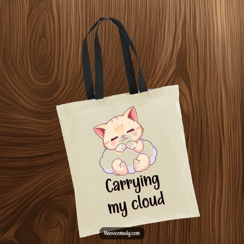 Funny tote bag with a serene cat kneading a fluffy cloud, ideal for carrying groceries or essentials with a smile.